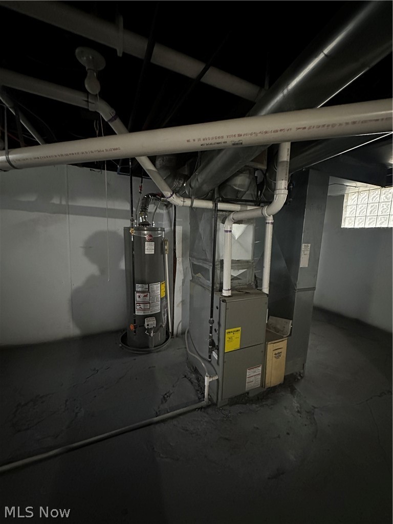 1655 Manchester Road Akron, OH 44314 - Photo 5 of 5 Utility room with heating unit and water heater
