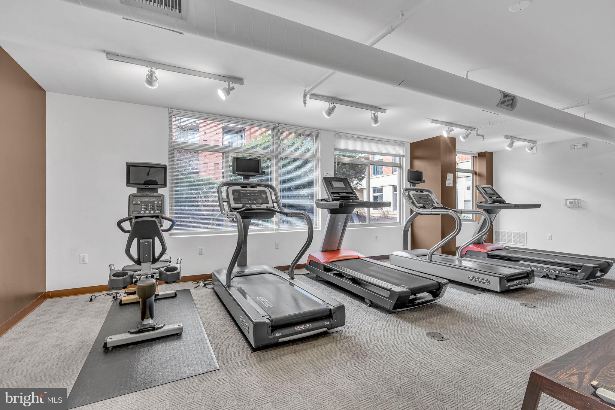 3600 South Glebe Road, Unit 606W Arlington, VA 22202 - Photo 24 of 30 a room with gym equipment and windows