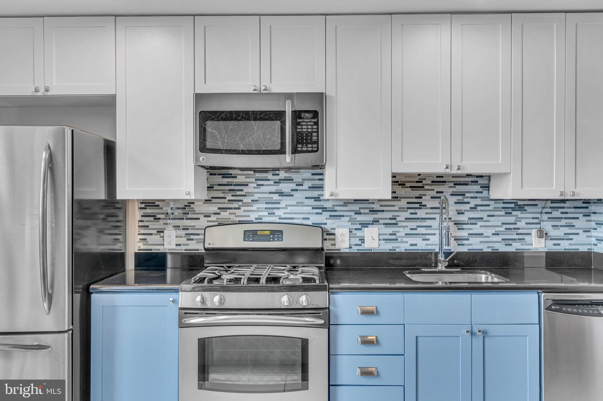 3600 South Glebe Road, Unit 606W Arlington, VA 22202 - Photo 8 of 30 a kitchen with granite countertop white cabinets and stainless steel appliances