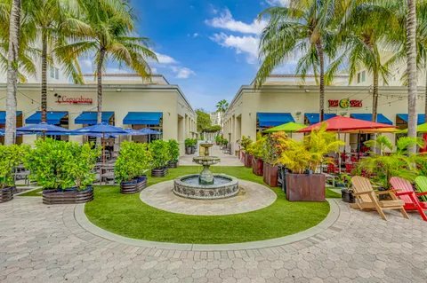 a view of a house with sitting area and garden