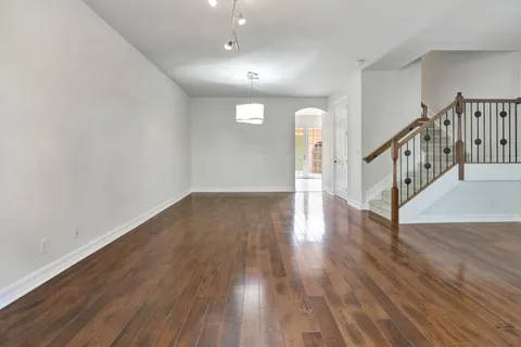 a view of interior space with wooden floor and stairs