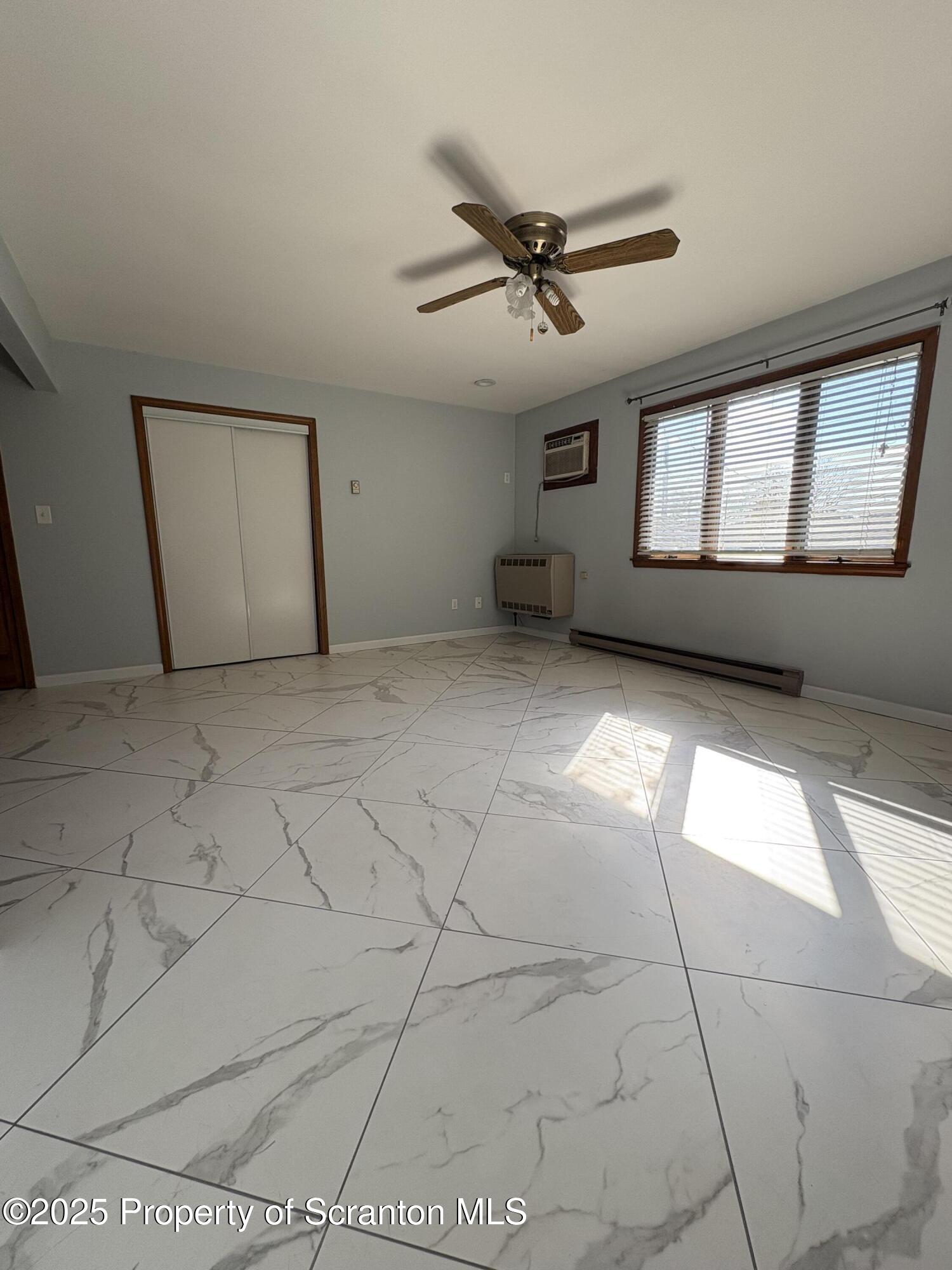 559 Penn Avenue, Unit A Mayfield, PA 18433 - Photo 5 of 9 a view of an empty room with a window