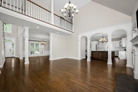 a view of an entryway with wooden floor