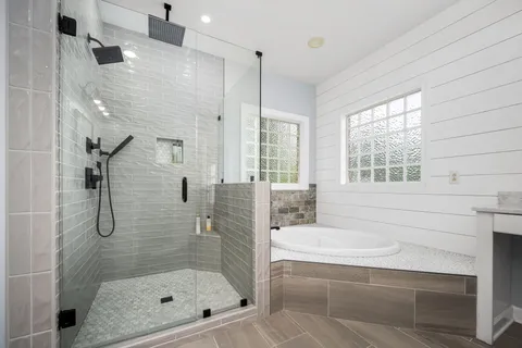 a bathroom with a shower bathtub and a shower