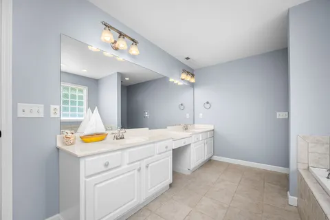a view of a kitchen with a sink and a chandelier