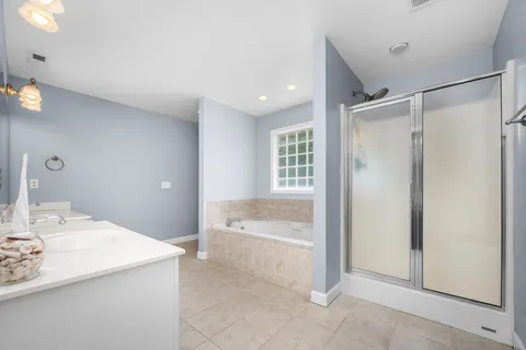 a bathroom with a shower and a sink