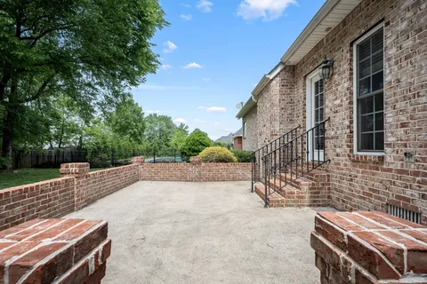 a view of a backyard with sitting area