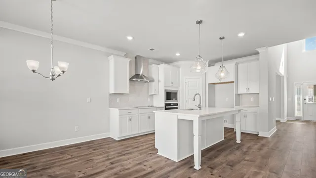 a view of a room with wooden floor and windows
