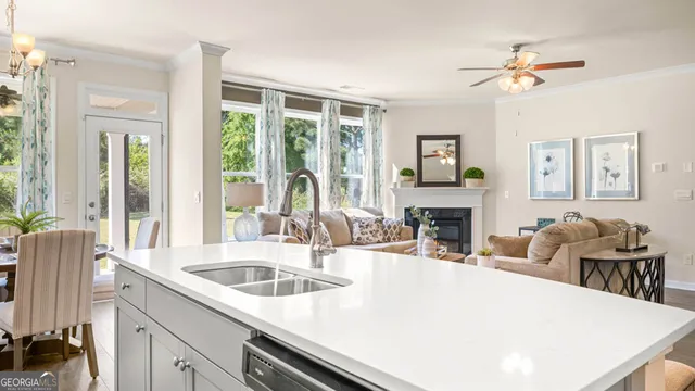 a bedroom with a bed and large window