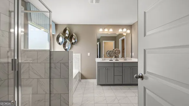 a bathroom with a sink and mirror