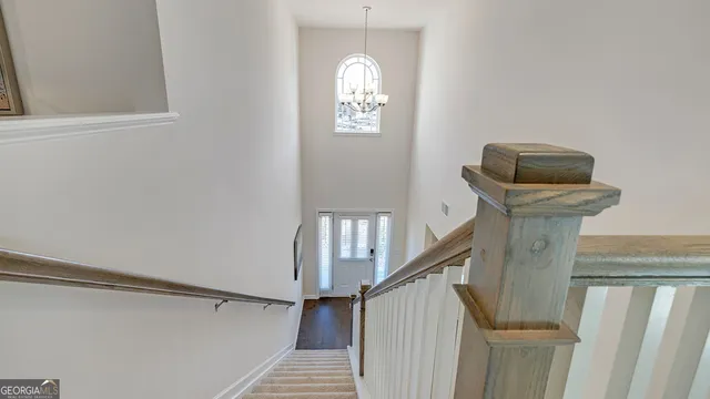 a living room with furniture and a baby crib