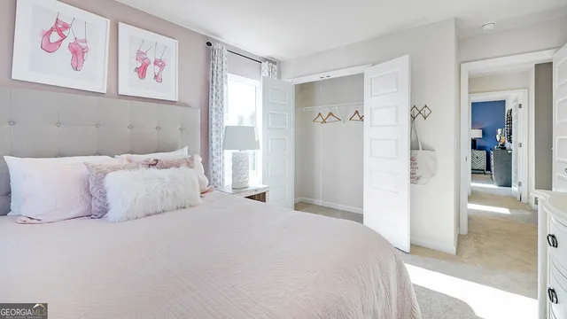 a bathroom with a granite countertop sink toilet and mirror