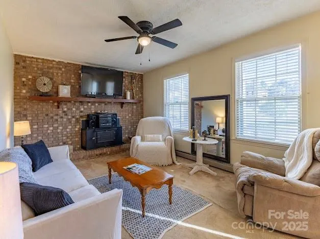 a dining room with furniture a rug and a large window