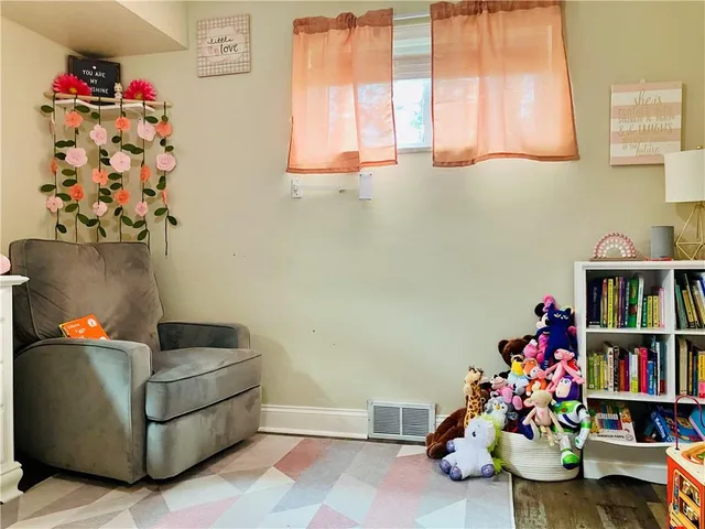 a bedroom with a bed and a table