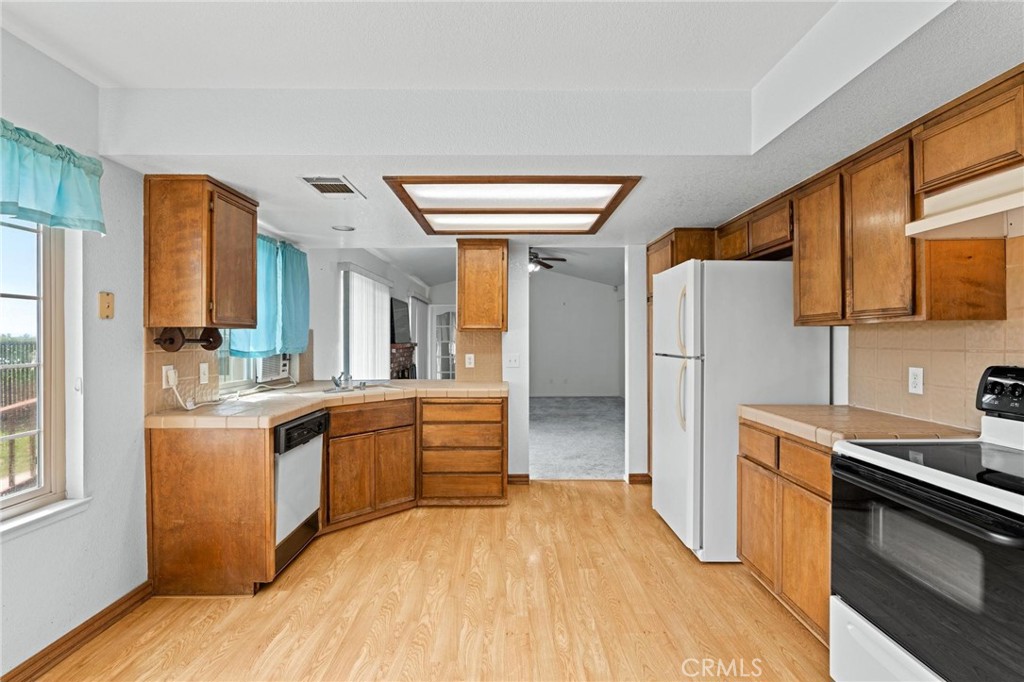 3345 Ave Two Atwater, CA 95301 - Photo 15 of 50 a kitchen with stainless steel appliances granite countertop a sink stove and refrigerator