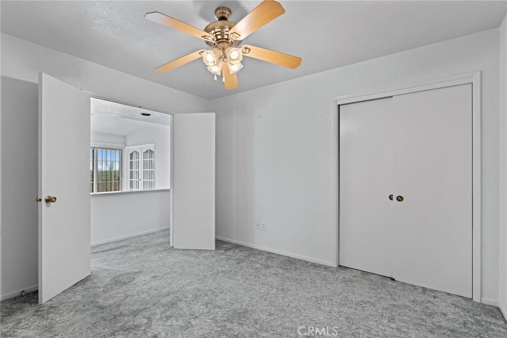 3345 Ave Two Atwater, CA 95301 - Photo 27 of 50 an empty room with chandelier fan