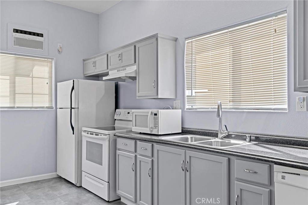 3345 Ave Two Atwater, CA 95301 - Photo 37 of 50 a kitchen with stainless steel appliances white cabinets and a sink
