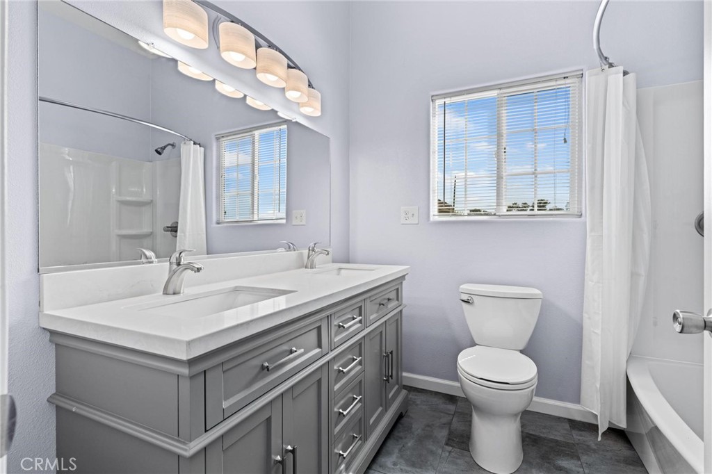 3345 Ave Two Atwater, CA 95301 - Photo 41 of 50 a bathroom with a sink toilet and mirror