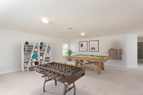 a living room with furniture rug and window