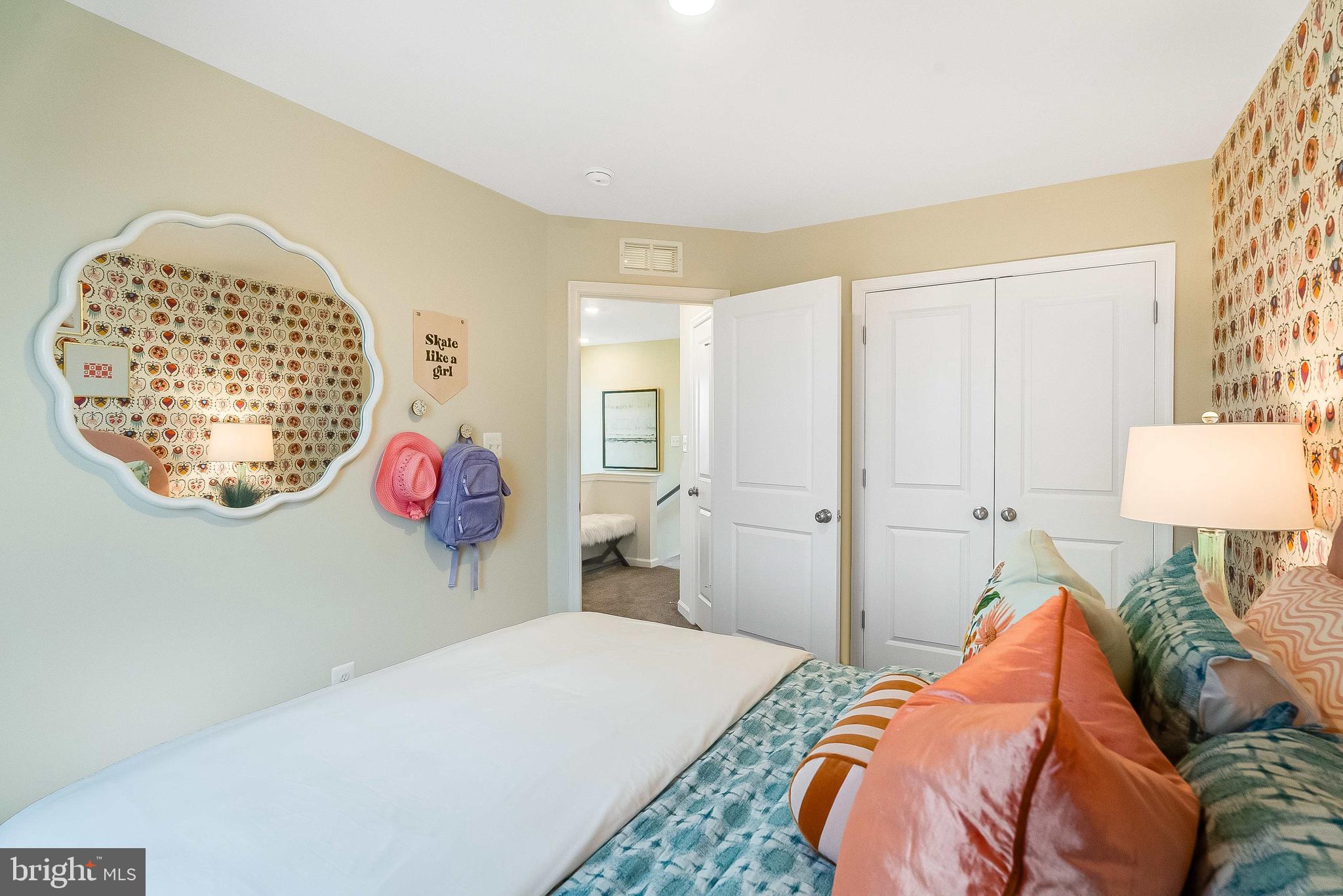 1266 Red Clover Lane Ranson, WV 25438 - Photo 20 of 24 a bed room with a bed and a table