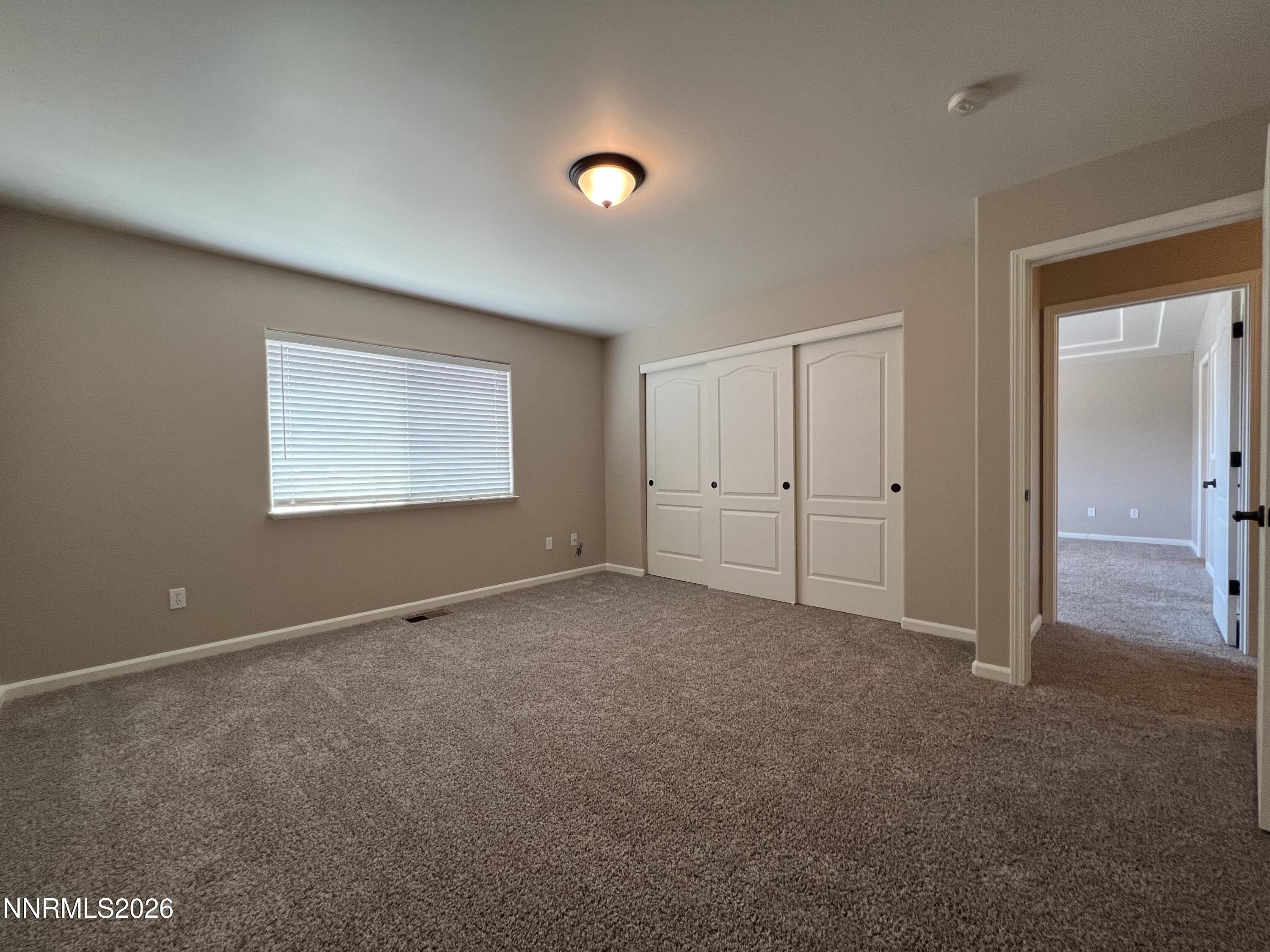 18406 Teddy Bear Court Reno, NV 89508 - Photo 23 of 44 a view of an empty room with a window