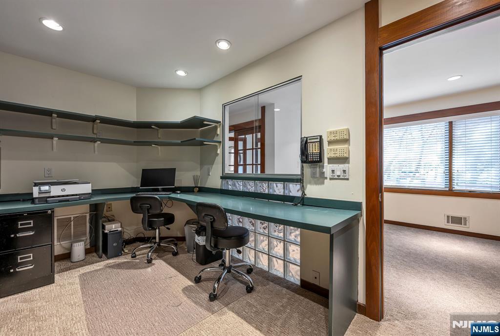 84 Bogerts Mill Road Harrington Park, NJ 07640 - Photo 40 of 47 a view of a workspace with furniture and a window
