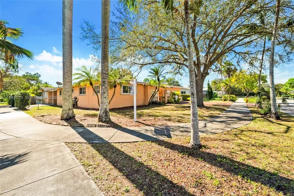 a view of a backyard of the house