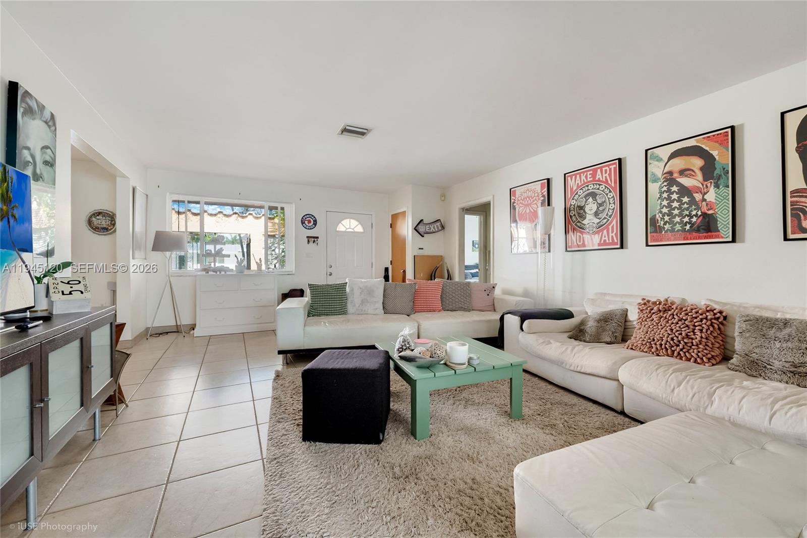 5700 Southwest 45th Terrace Miami, FL 33155 - Photo 2 of 15 a living room with furniture and a large window