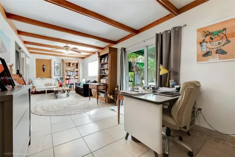 a view of a livingroom with furniture and window