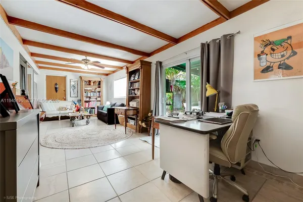 a view of a livingroom with furniture and window