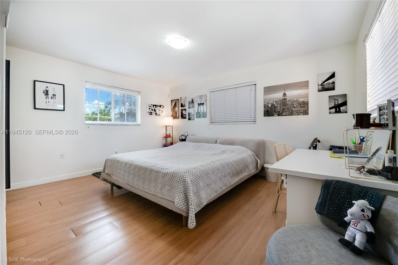 5700 Southwest 45th Terrace Miami, FL 33155 - Photo 10 of 15 a bedroom with a bed and a desk