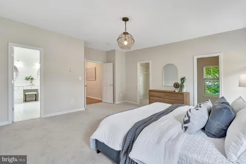 a bedroom with a bed and a mirror