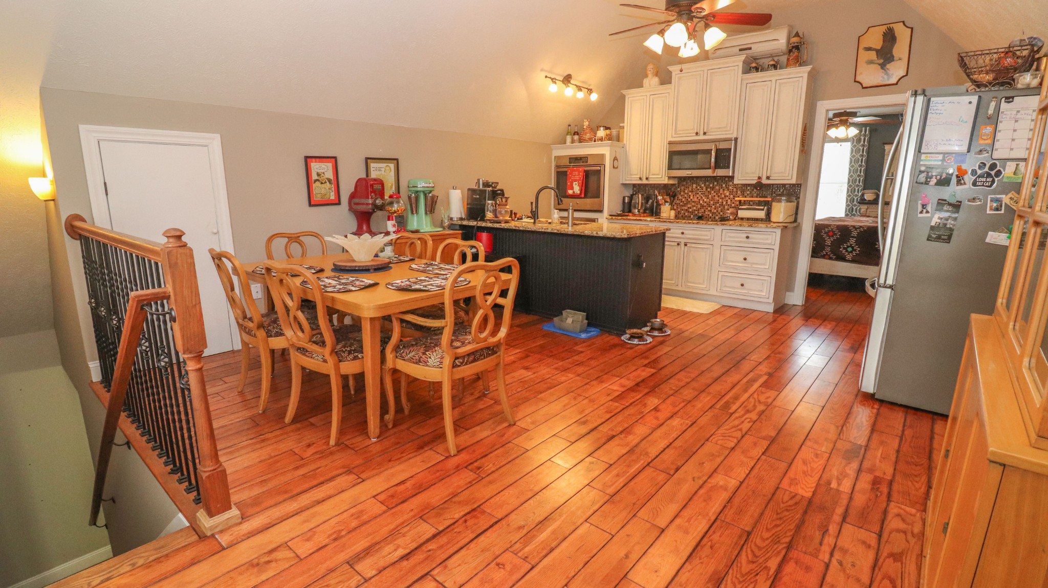 182 Lohrig Road Jackson, TN 38301 - Photo 13 of 25 a kitchen with stainless steel appliances a dining table chairs stove refrigerator and cabinets