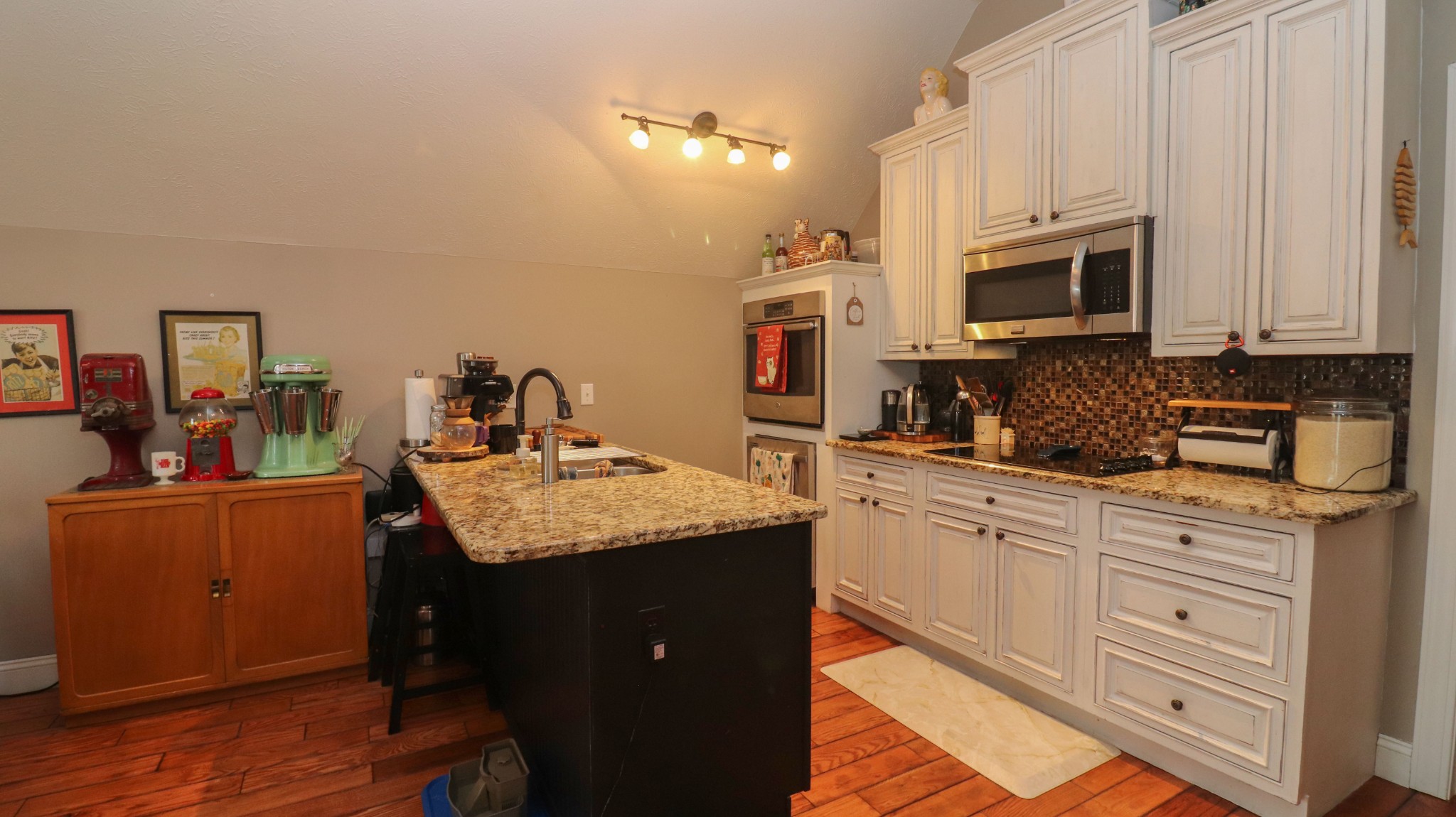 182 Lohrig Road Jackson, TN 38301 - Photo 15 of 25 a kitchen with stainless steel appliances granite countertop a sink stove and cabinets