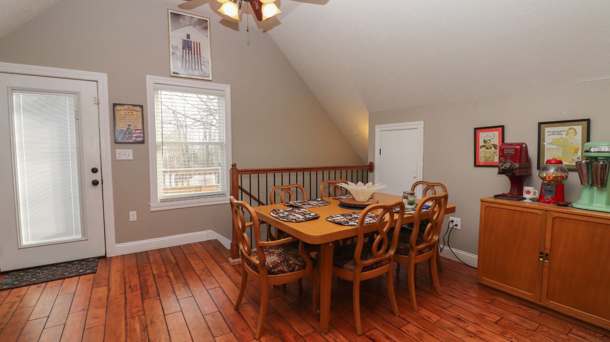 182 Lohrig Road Jackson, TN 38301 - Photo 16 of 25 a dining room with furniture a chandelier and wooden floor