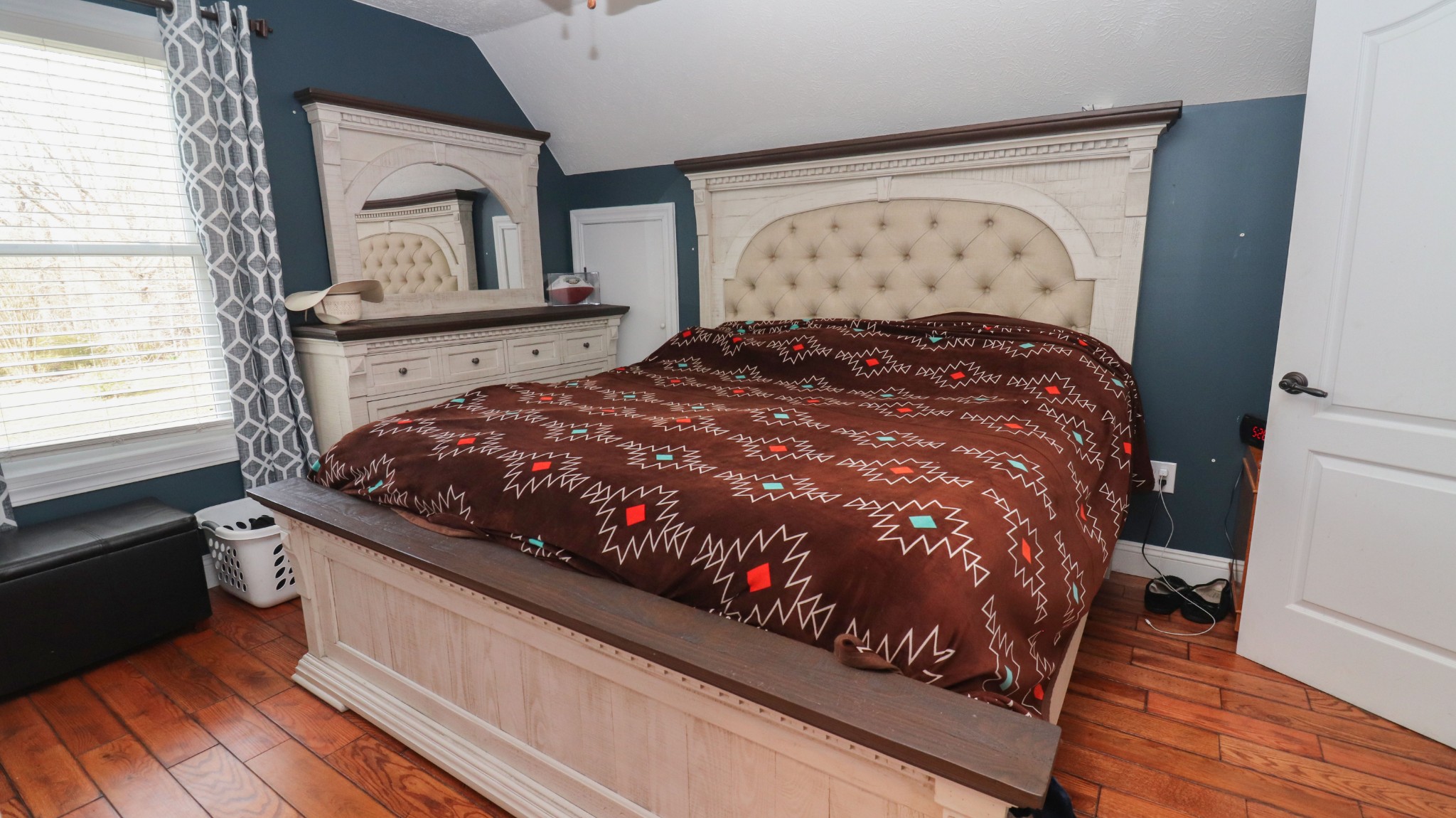 182 Lohrig Road Jackson, TN 38301 - Photo 17 of 25 a bed sitting in a bedroom next to a window