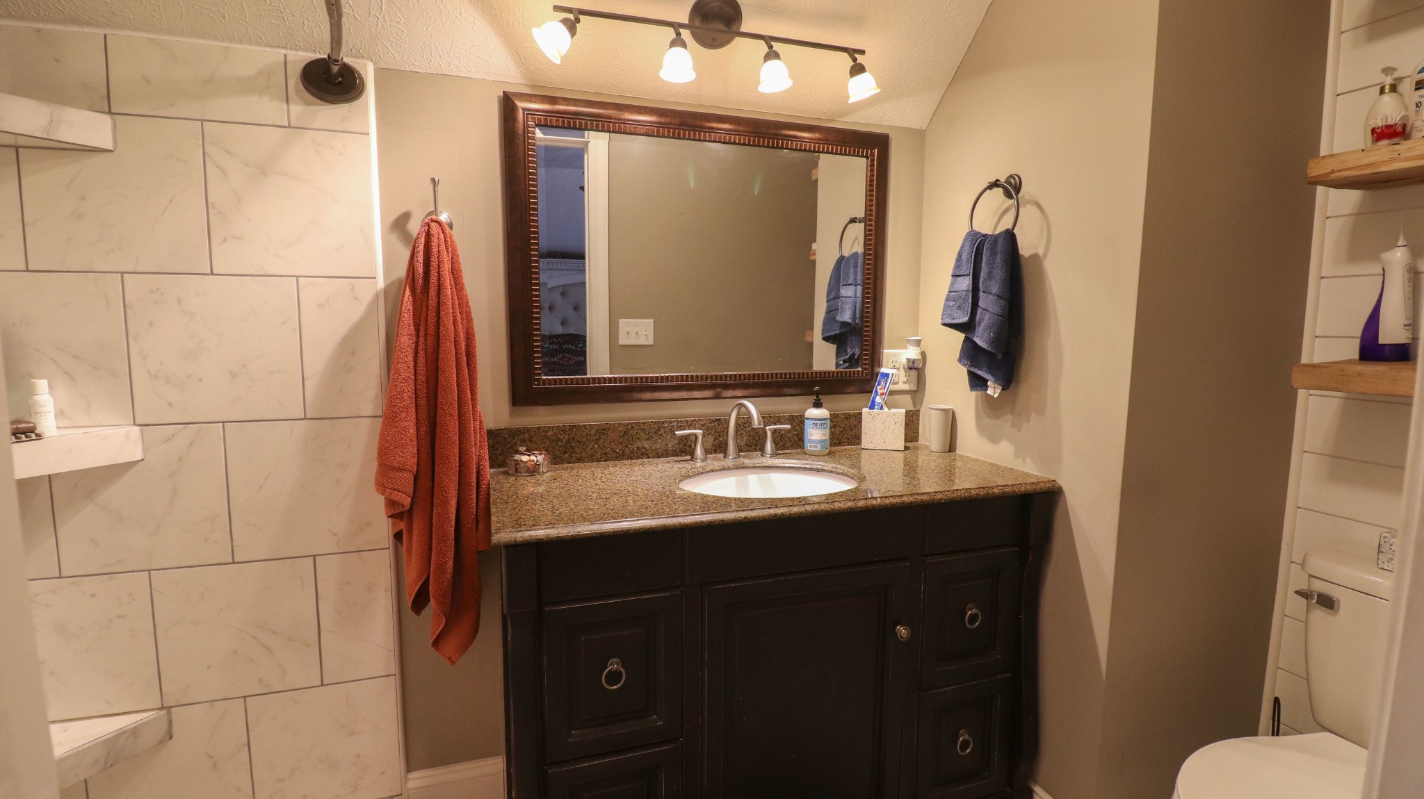182 Lohrig Road Jackson, TN 38301 - Photo 18 of 25 a bathroom with a sink vanity granite and a mirror