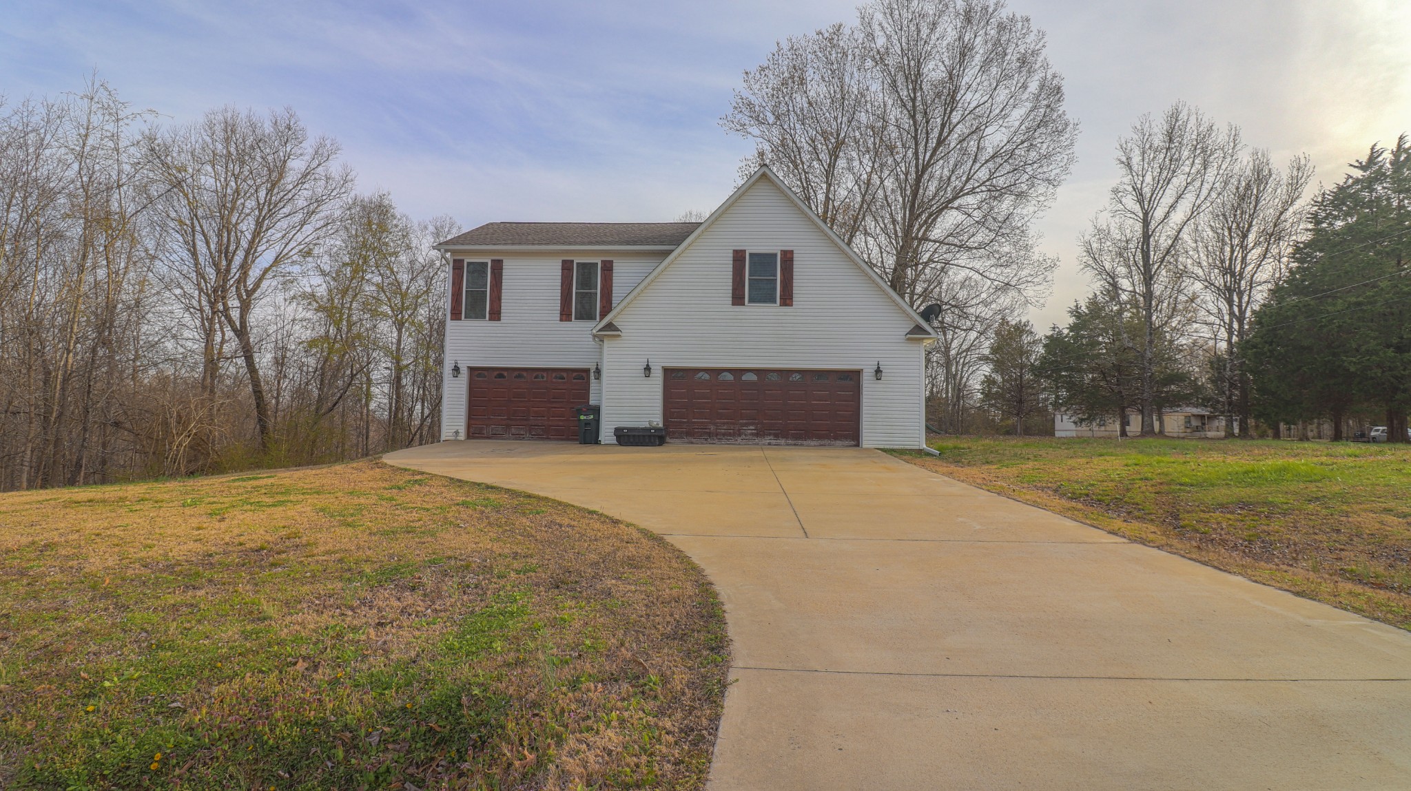 182 Lohrig Road Jackson, TN 38301 - Photo 7 of 25 a house with trees in front of it
