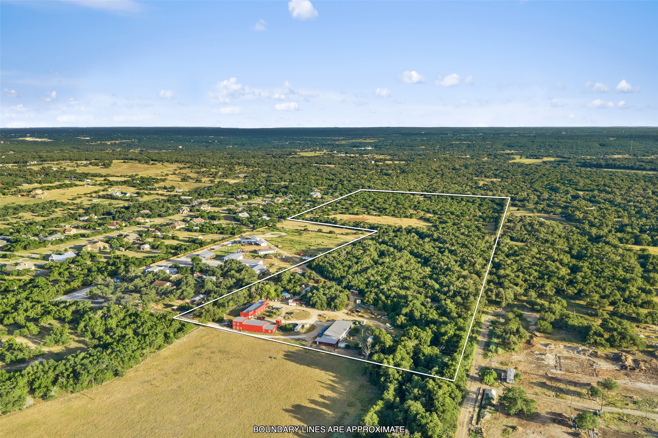 0 Hays Country Acres Road Dripping Springs, TX 78620 - Photo 5 of 33 Mature woodlands and open pastures define this substantial rural acreage under clear blue skies.