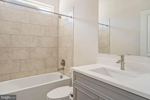 a bathroom with a sink toilet and bathtub