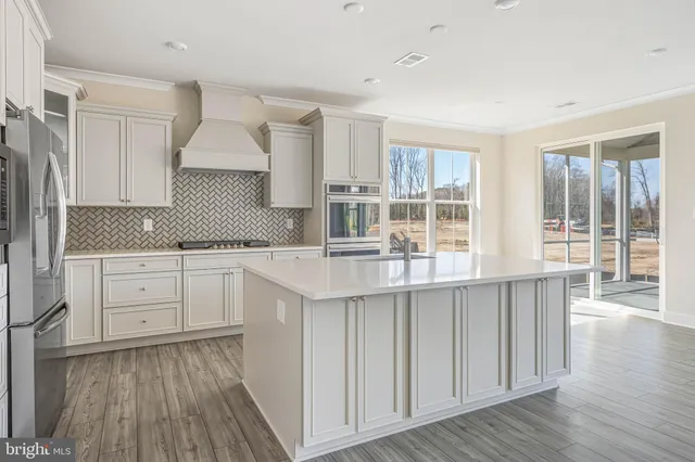 a kitchen with sink and cabinets