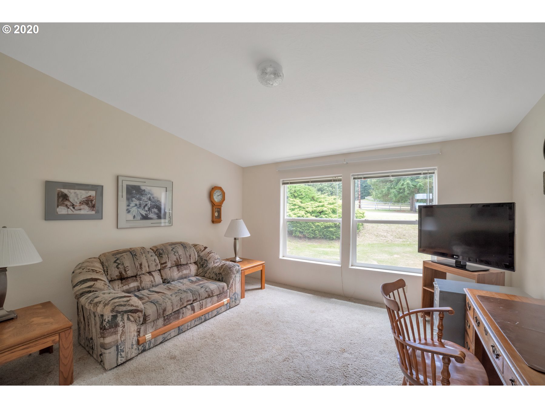 6990 Northwest Canyonview Road Gaston, OR 97119 - Photo 11 of 32 a living room with furniture and a flat screen tv