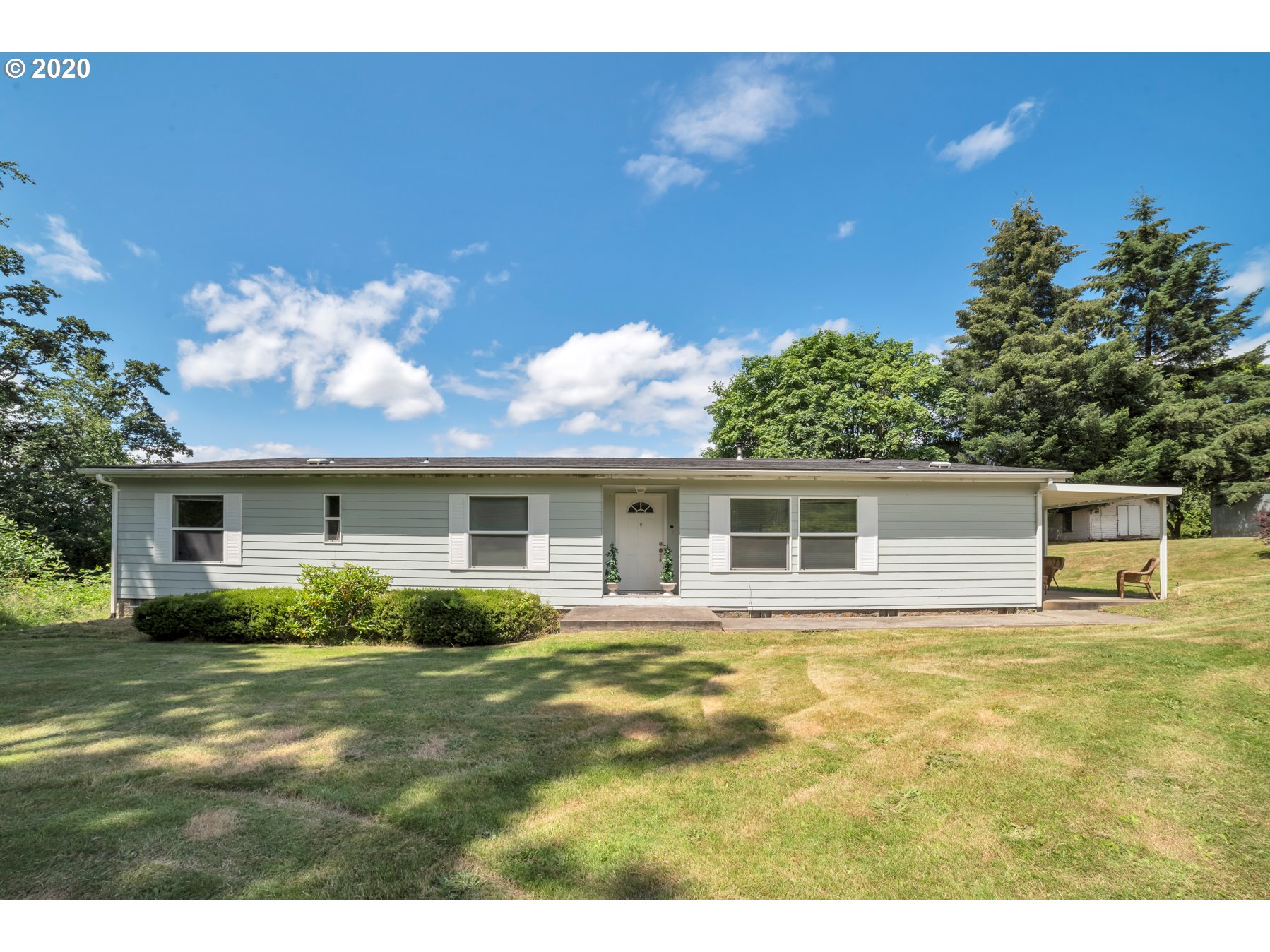 6990 Northwest Canyonview Road Gaston, OR 97119 - Photo 2 of 32 a view of a house with a yard