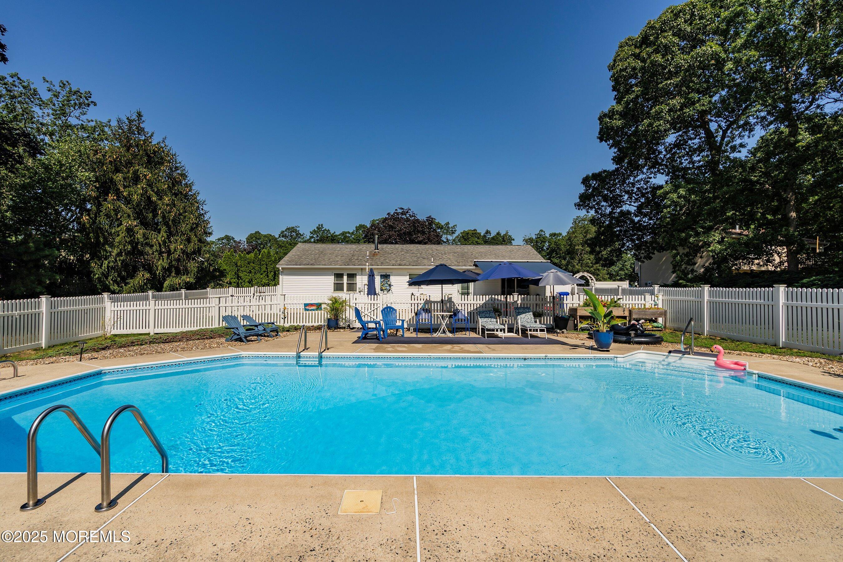 718 Millbrook Road Brick, NJ 08724 - Photo 17 of 26 a view of a house with swimming pool and sitting area