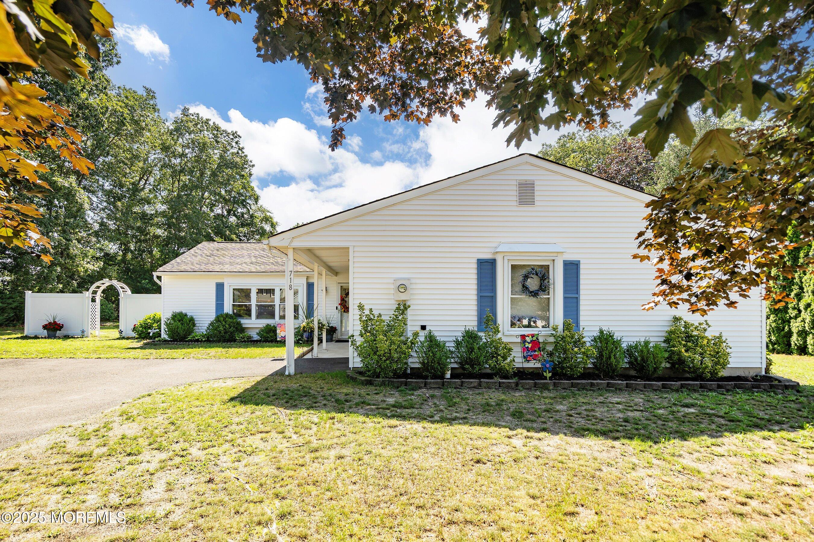 718 Millbrook Road Brick, NJ 08724 - Photo 2 of 26 a front view of a house with a yard and trees