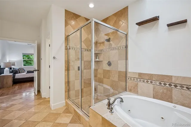 a bathroom with a bathtub and a shower