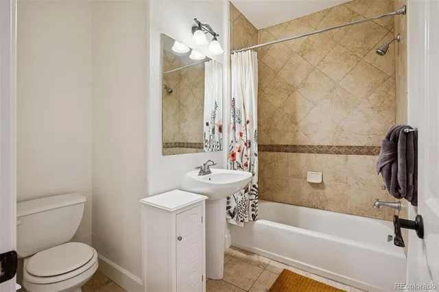 a bathroom with a sink a toilet and a bathtub