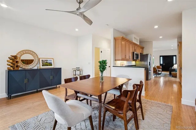 a view of a dining room with furniture and wooden floor
