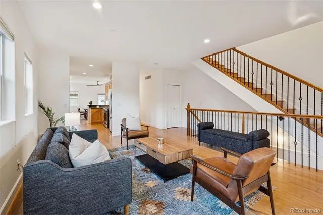 a outdoor living room with furniture and a wooden floor
