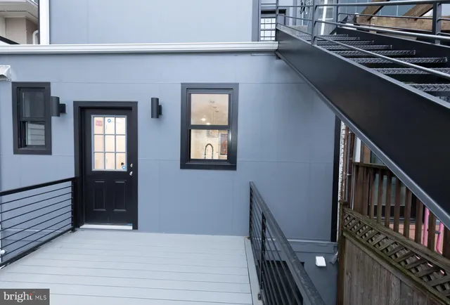 a view of an entryway with wooden floor